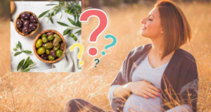 Donna incinta seduta in un campo dorato che accarezza il pancione, affiancata da un riquadro con ciotole di olive verdi e nere e diversi punti interrogativi colorati.